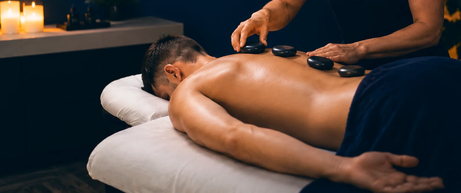 Hot stone massage in progress at A-Game Care in Olds, Alberta